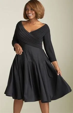 Plus size black dress outfit: long sleeve wrap skater dress