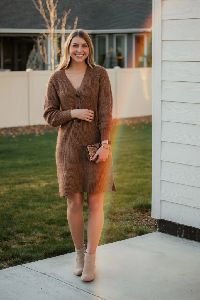 Thanksgiving sweater outfit: brown ribbed sweater dress with booties