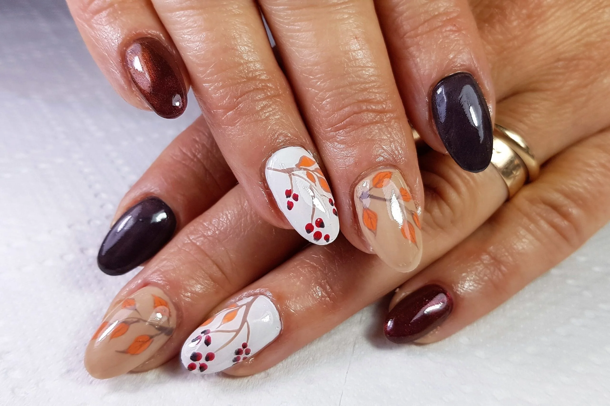 Easy fall nail ideas: deep plum nails with white floral accents