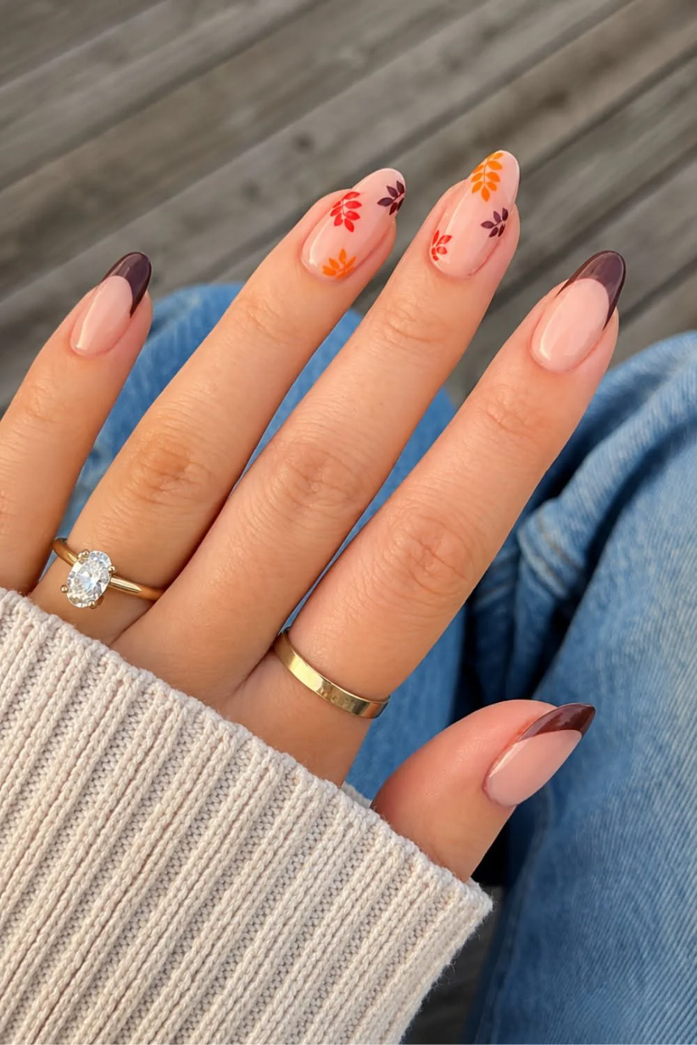 Easy fall nail ideas: nude nails with tiny autumn leaf art