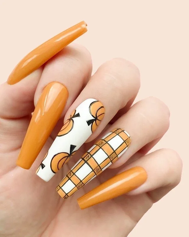 Easy fall nail ideas: pumpkin orange nails with plaid art