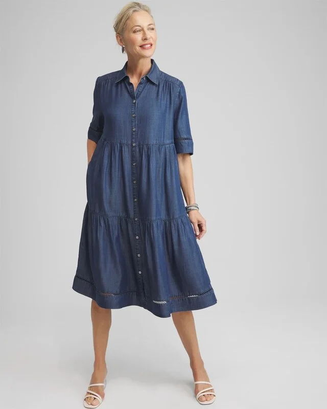 Mature woman in navy chambray shirtdress and sandals
