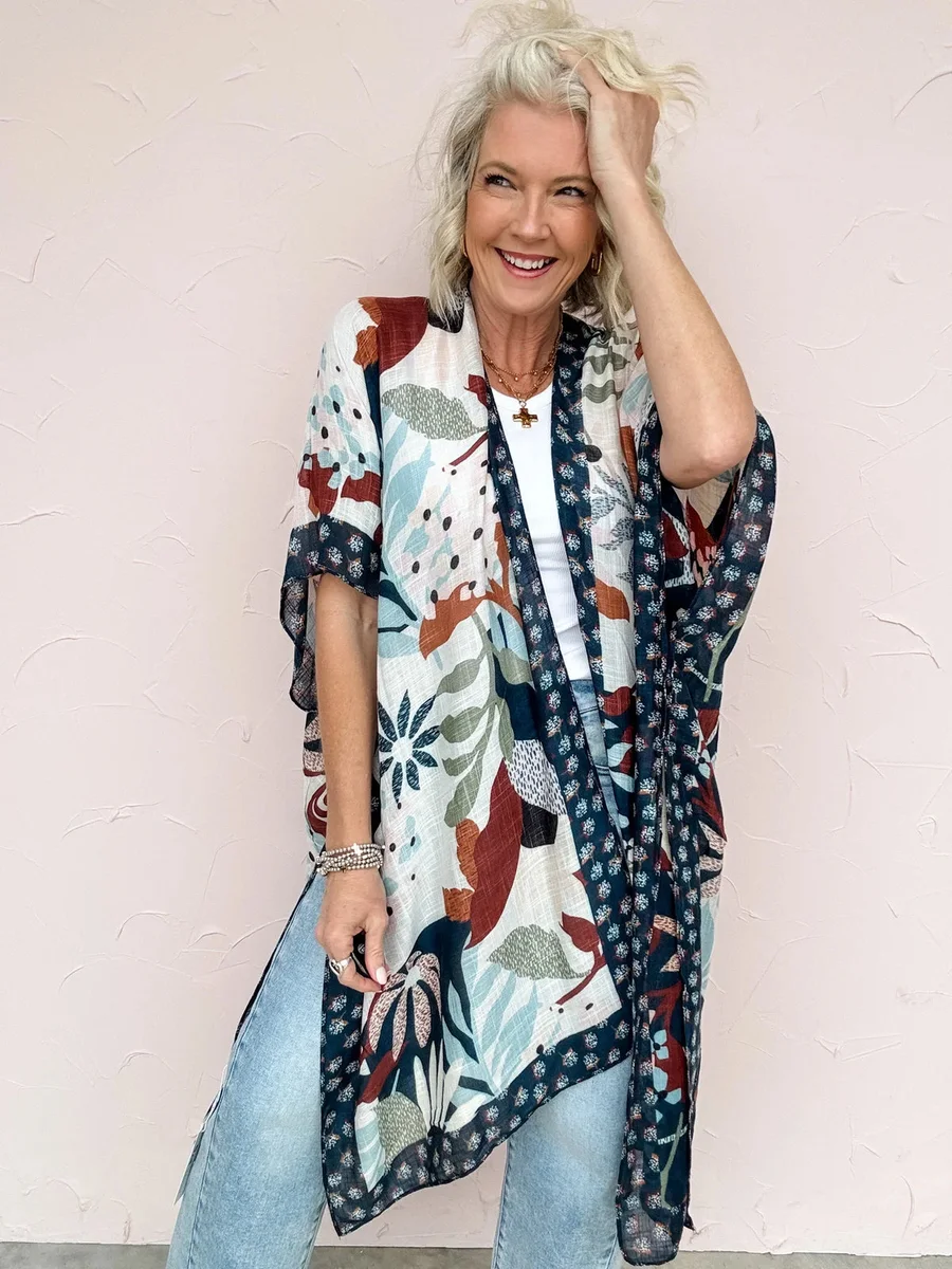 Mature woman in floral kimono and jeans