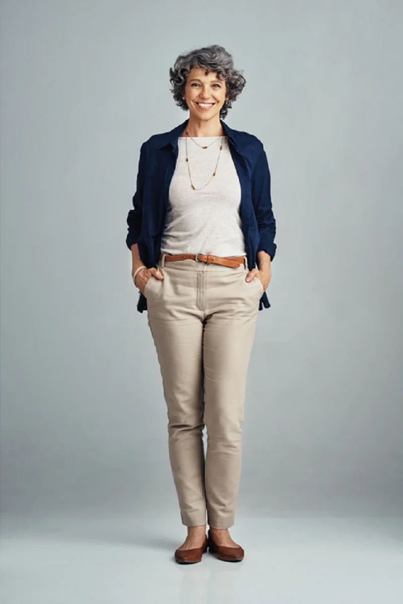 Mature woman in navy shirt and beige chinos