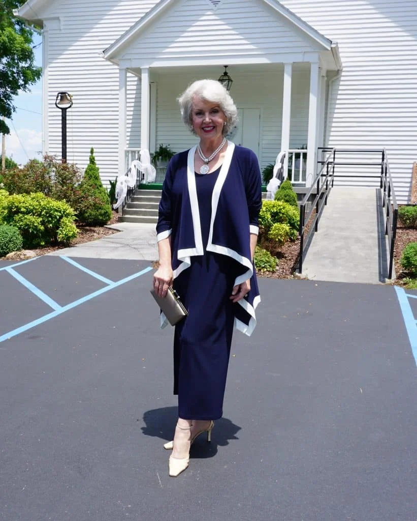 Elegant fall church outfit: navy dress with white trim cardigan