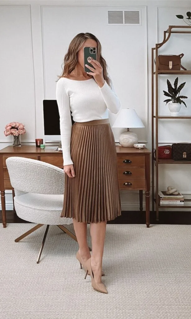 White knit top with brown pleated midi skirt