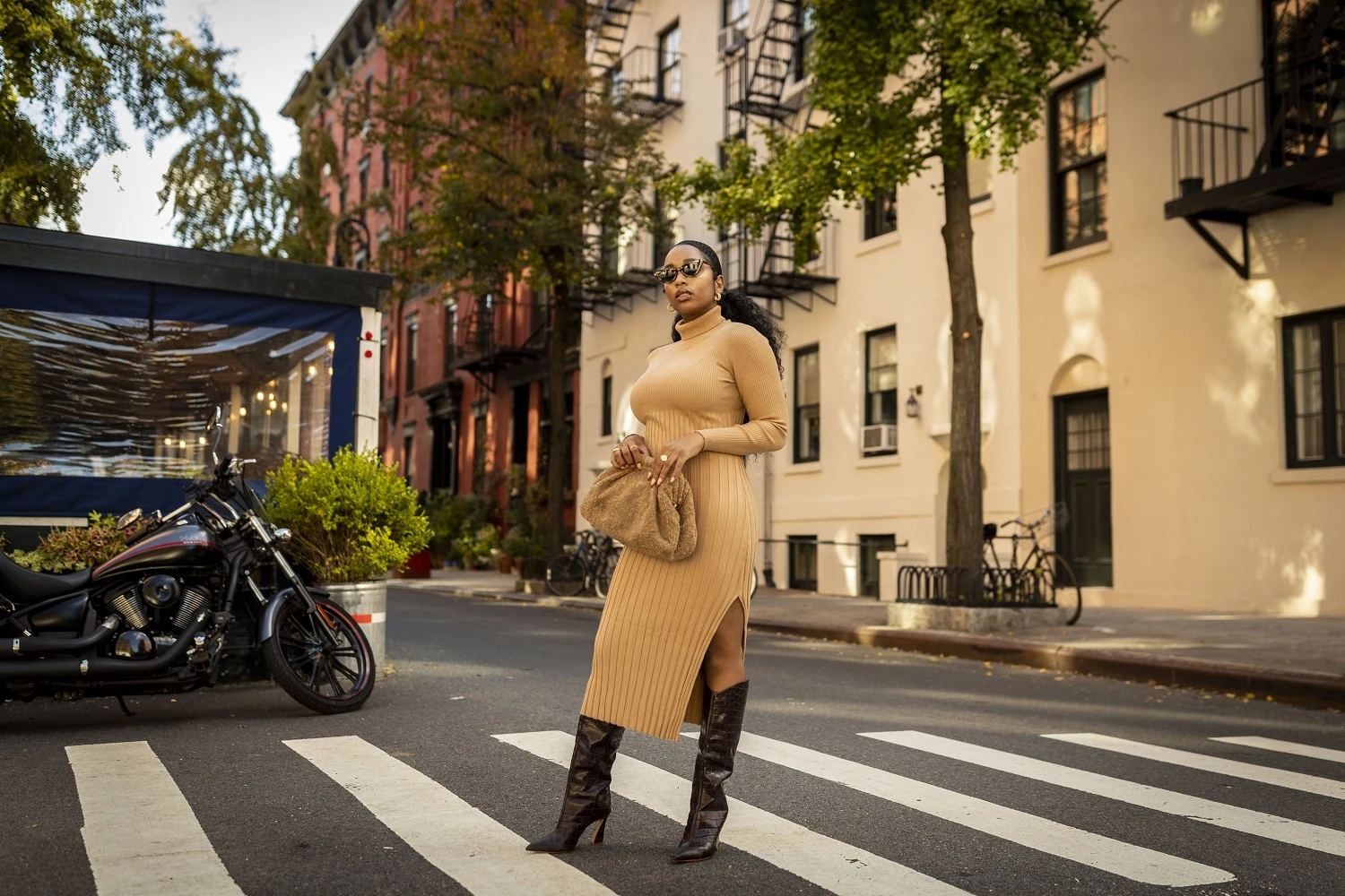 Fall game day outfit for Black women: camel ribbed turtleneck sweater dress with dark brown croc boots