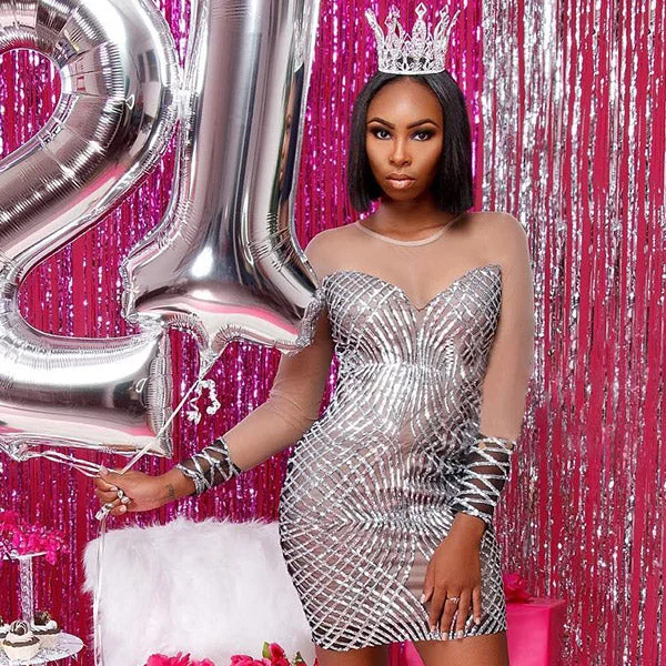 Silver sequin mini dress with crown and 21 balloons