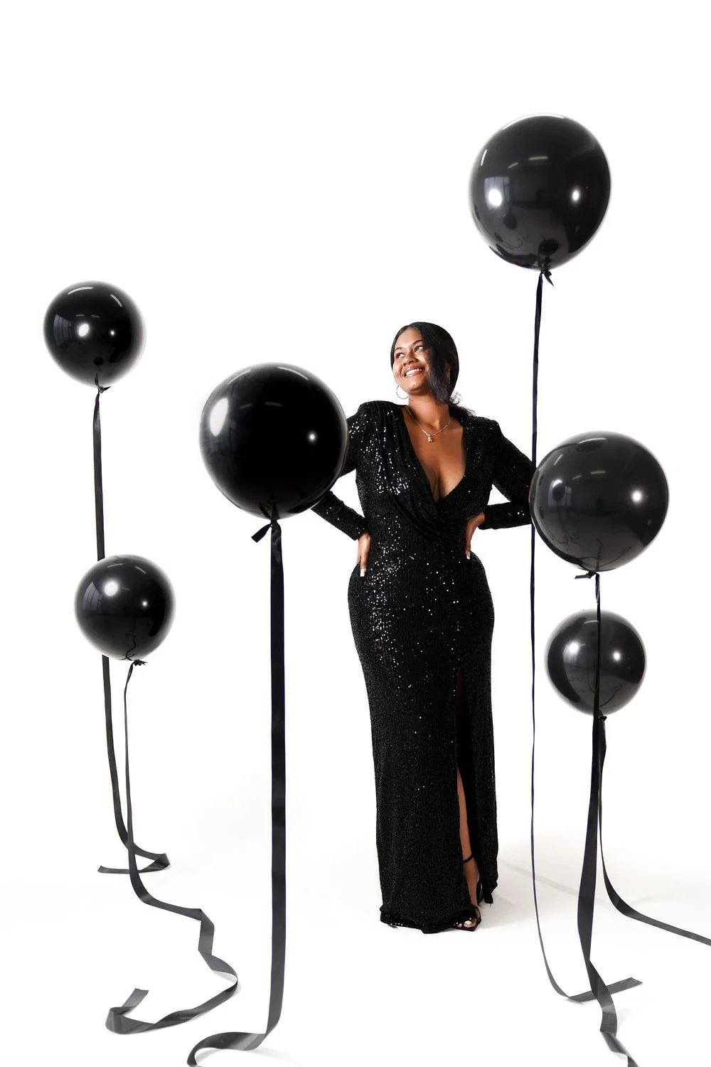 Black evening gown with black balloon stands