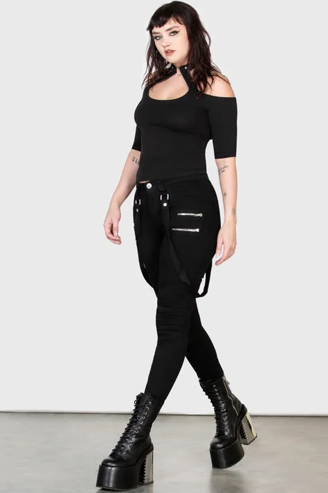 Goth outfit with jeans: grey baggy jeans with red hair
