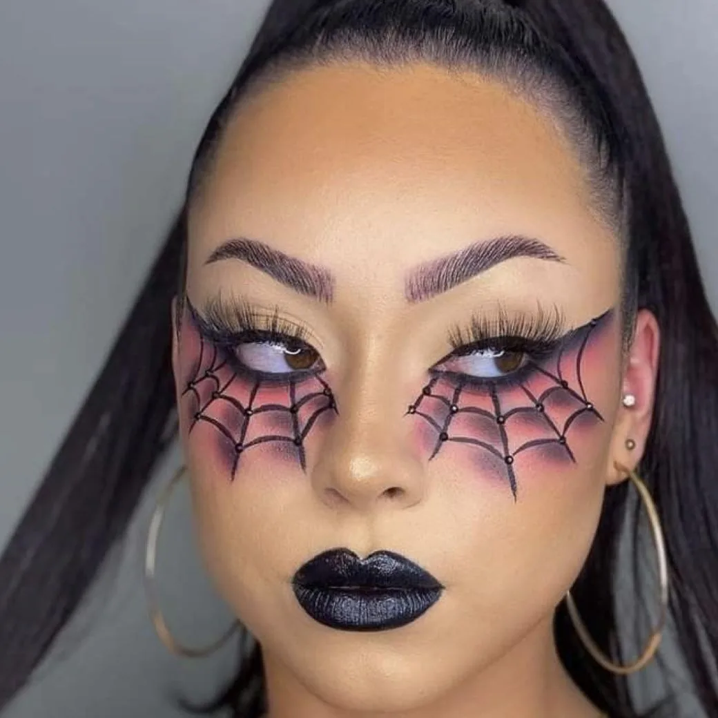 Spiderweb eye makeup with pink webs and dark lips