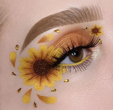 Sunflower eye art makeup with gold petals and yellow liner