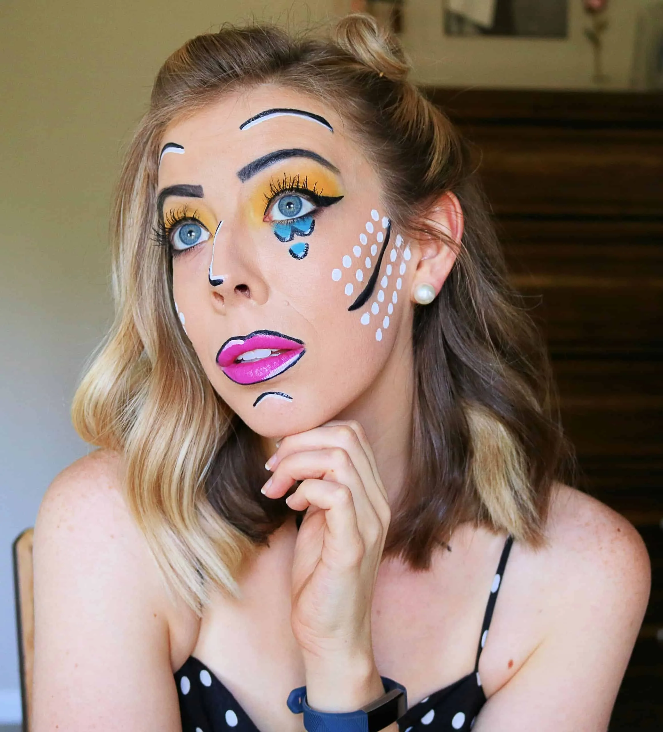 Pop art comic makeup with dots, outlines and pink lips
