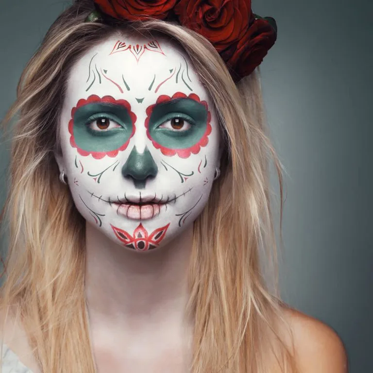Sugar skull makeup with red and green florals and rose crown