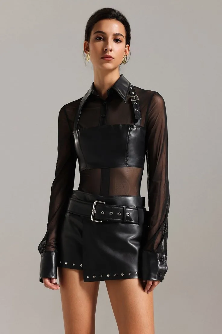 III points festival outfit: black leather crop top with sheer mesh shirt and studded mini skirt