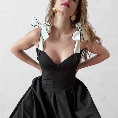 Black corset dress with white bow shoulder straps