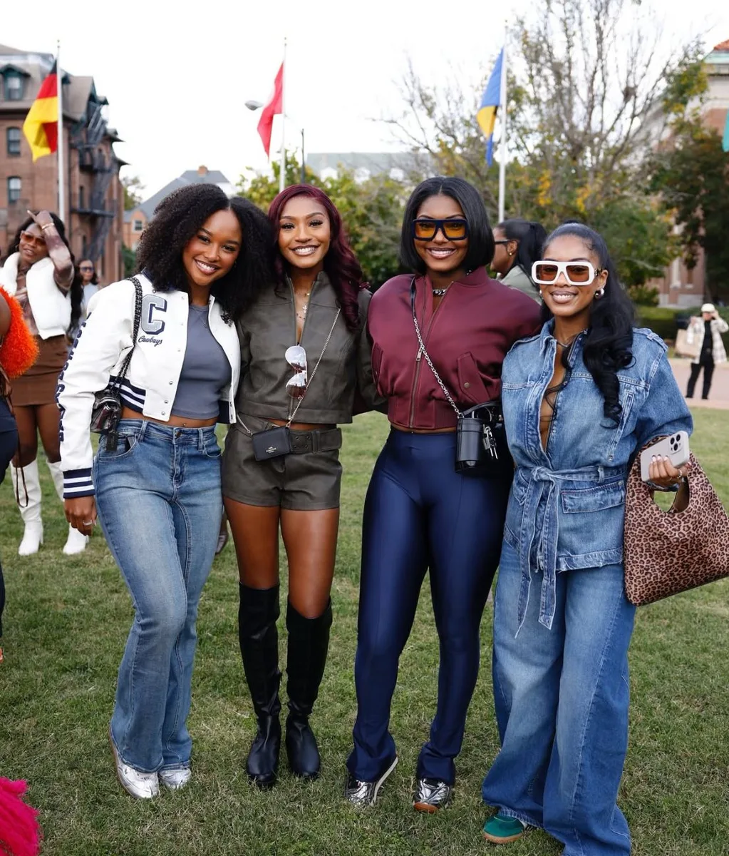 Group of Black women in casual jeans and tops at a homecoming tailgate