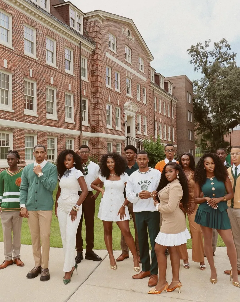 Group of Black students dressed up on campus for homecoming