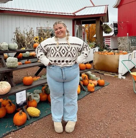 Plus size fall farm outfit: fair isle sweater with light jeans at the pumpkin stand