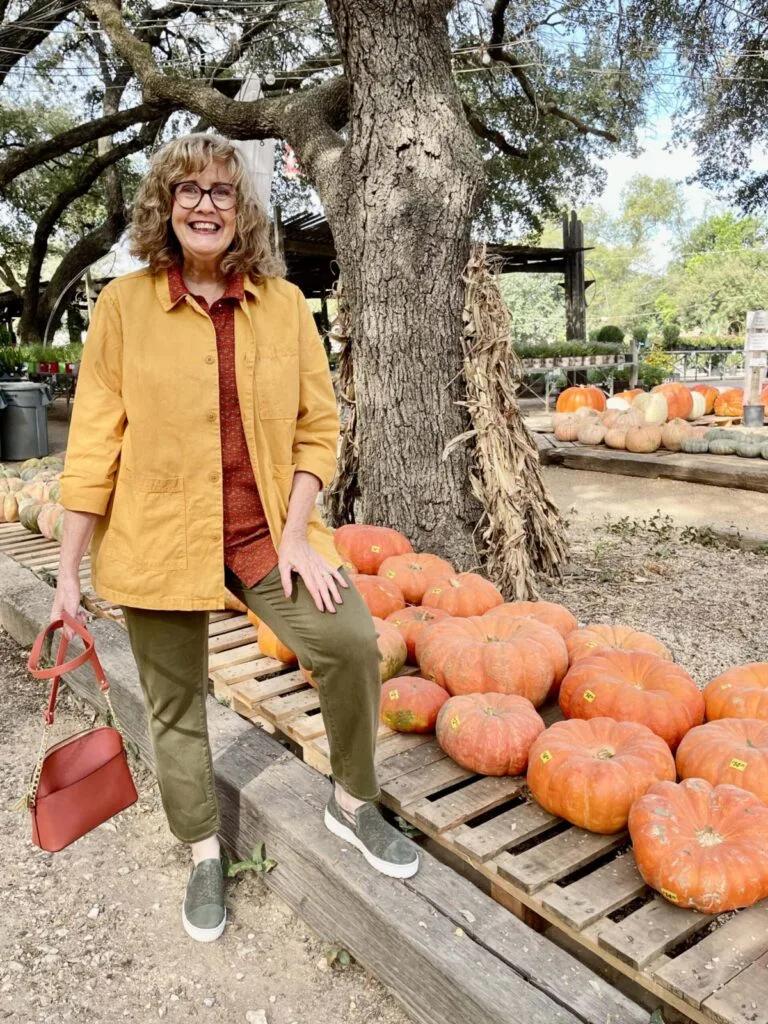 Fall pumpkin patch outfit: mustard yellow jacket with olive pants