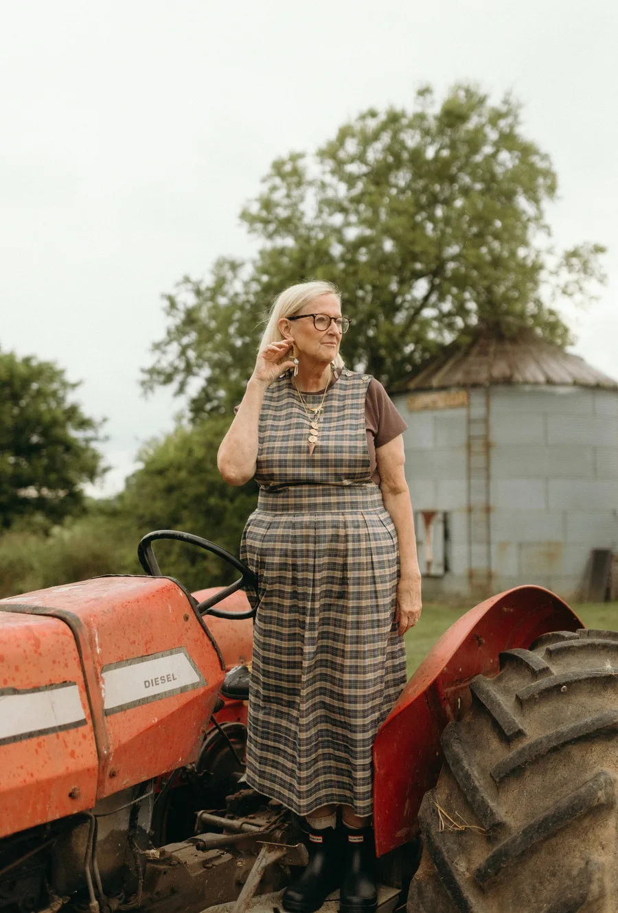 Pumpkin patch outfit: striped dress standing by a tractor