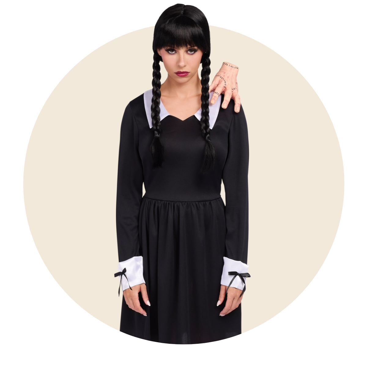 Woman dressed as Wednesday Addams in black dress with braids
