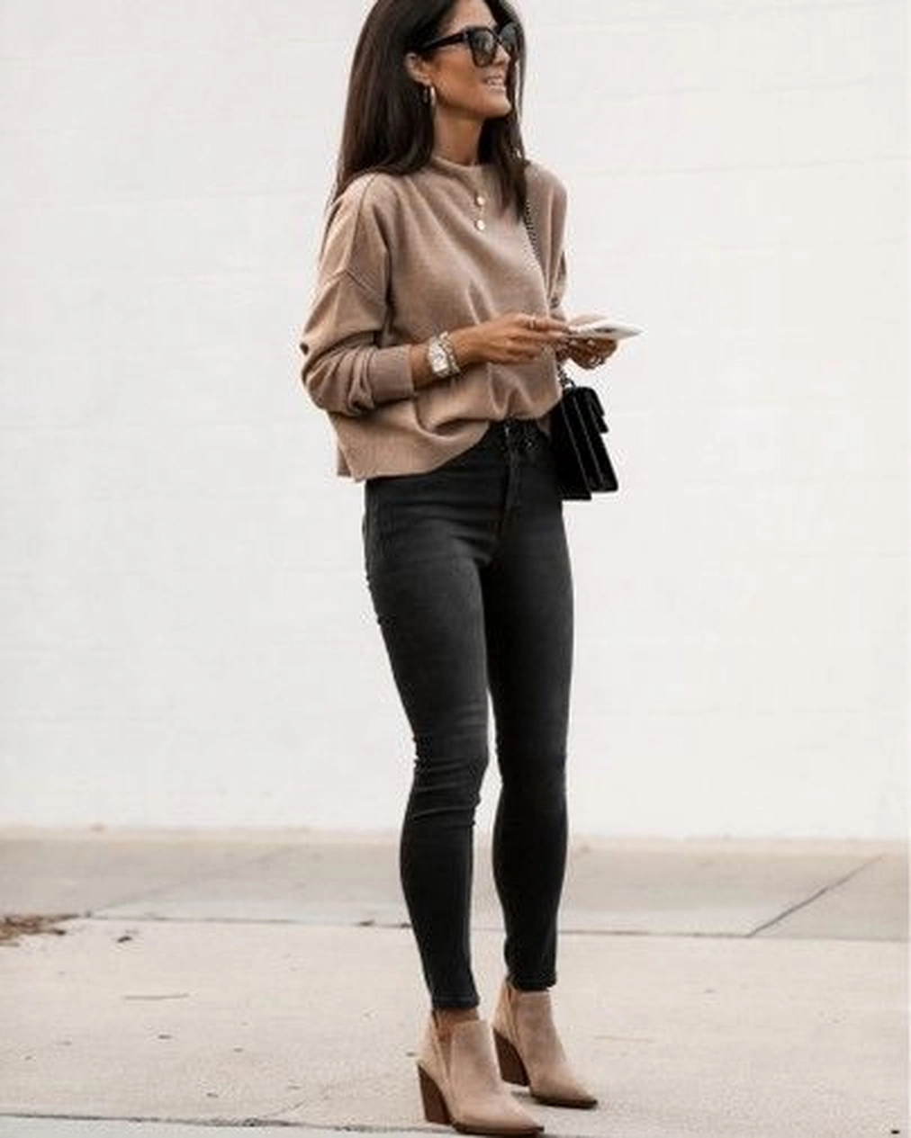 Beige sweater with black skinny jeans and pointed heels