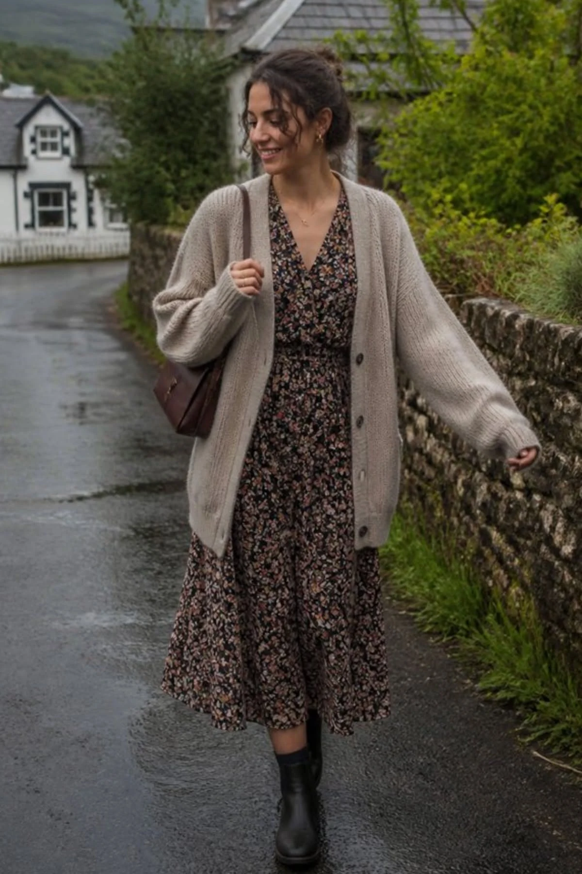 Dark floral midi dress with an oversized cardigan and ankle boots