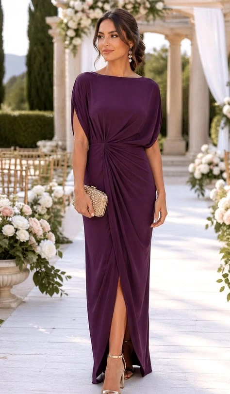 Deep plum draped midi dress with short sleeves and side slit at a wedding venue