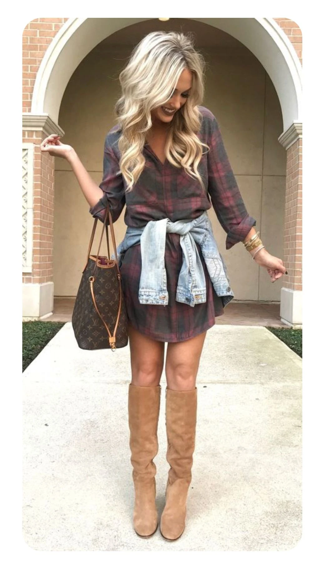 Plaid shirt dress with a denim shirt tied at the waist and tan knee boots