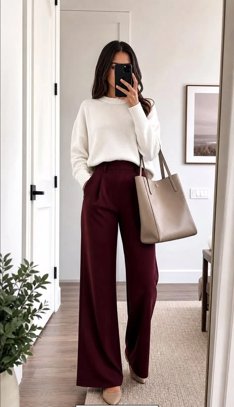 Cream knit sweater with burgundy wide leg trousers