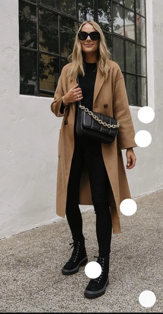 Camel wool coat over black leggings with knee high boots