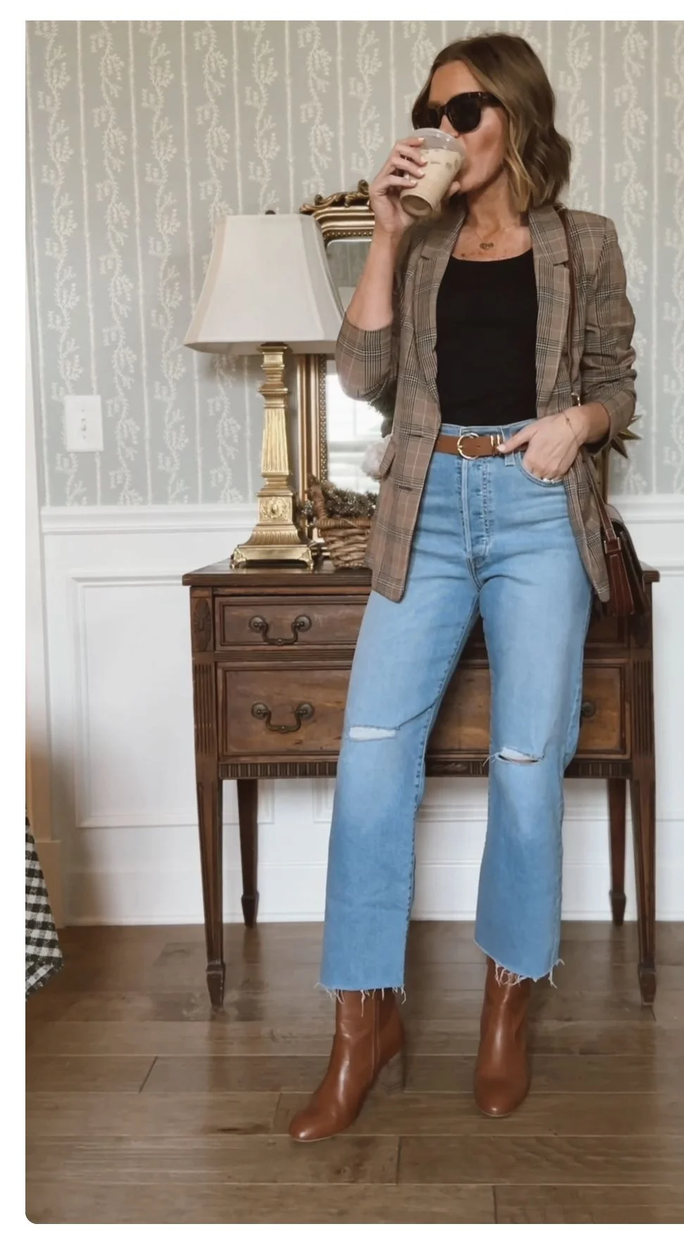 Thanksgiving outfit with plaid blazer, light straight jeans, and brown ankle boots