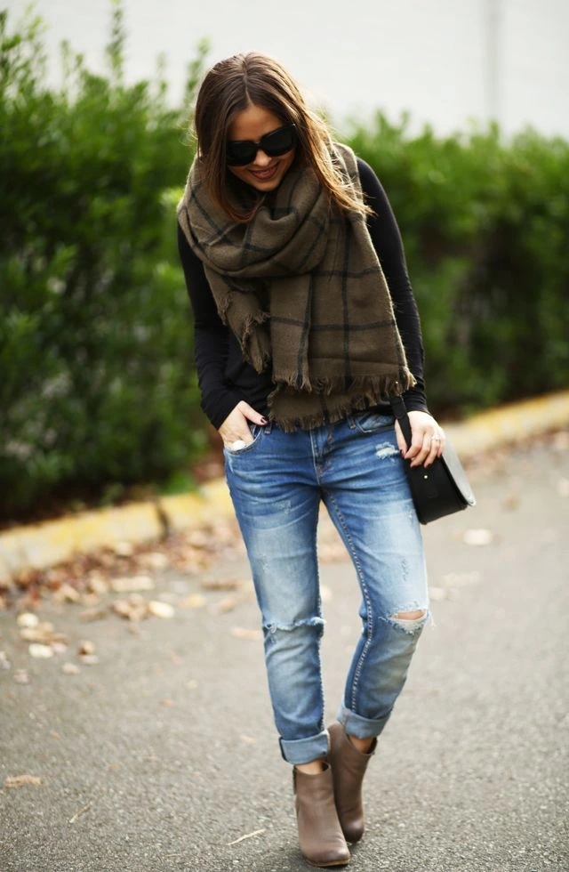 Thanksgiving outfit with plaid scarf, cuffed jeans, and suede ankle boots