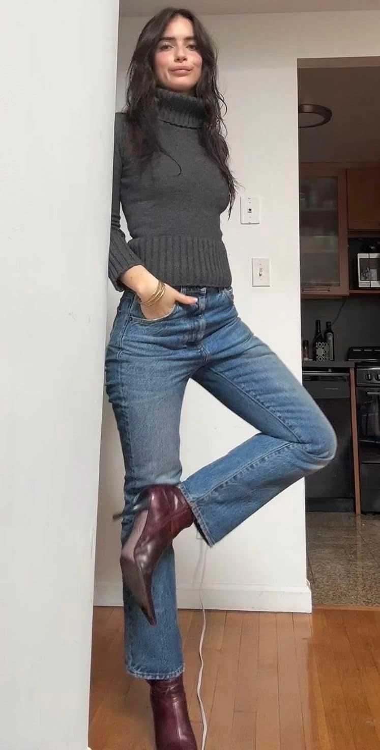 Thanksgiving outfit with fitted turtleneck, flared jeans, and heeled boots