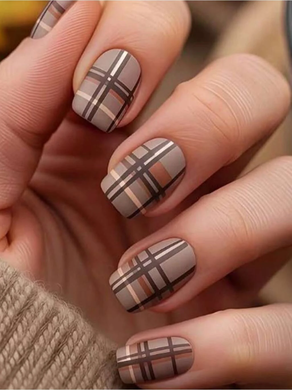 Taupe plaid nails with cream and brown lines on short nails