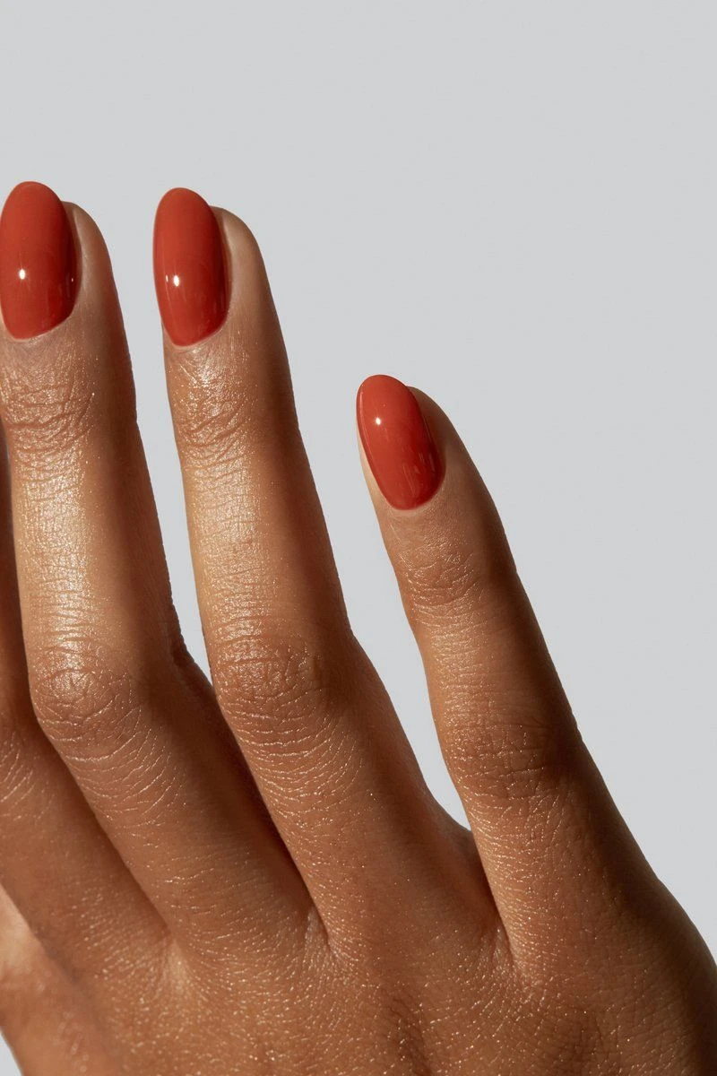 Short oval nails in glossy terracotta