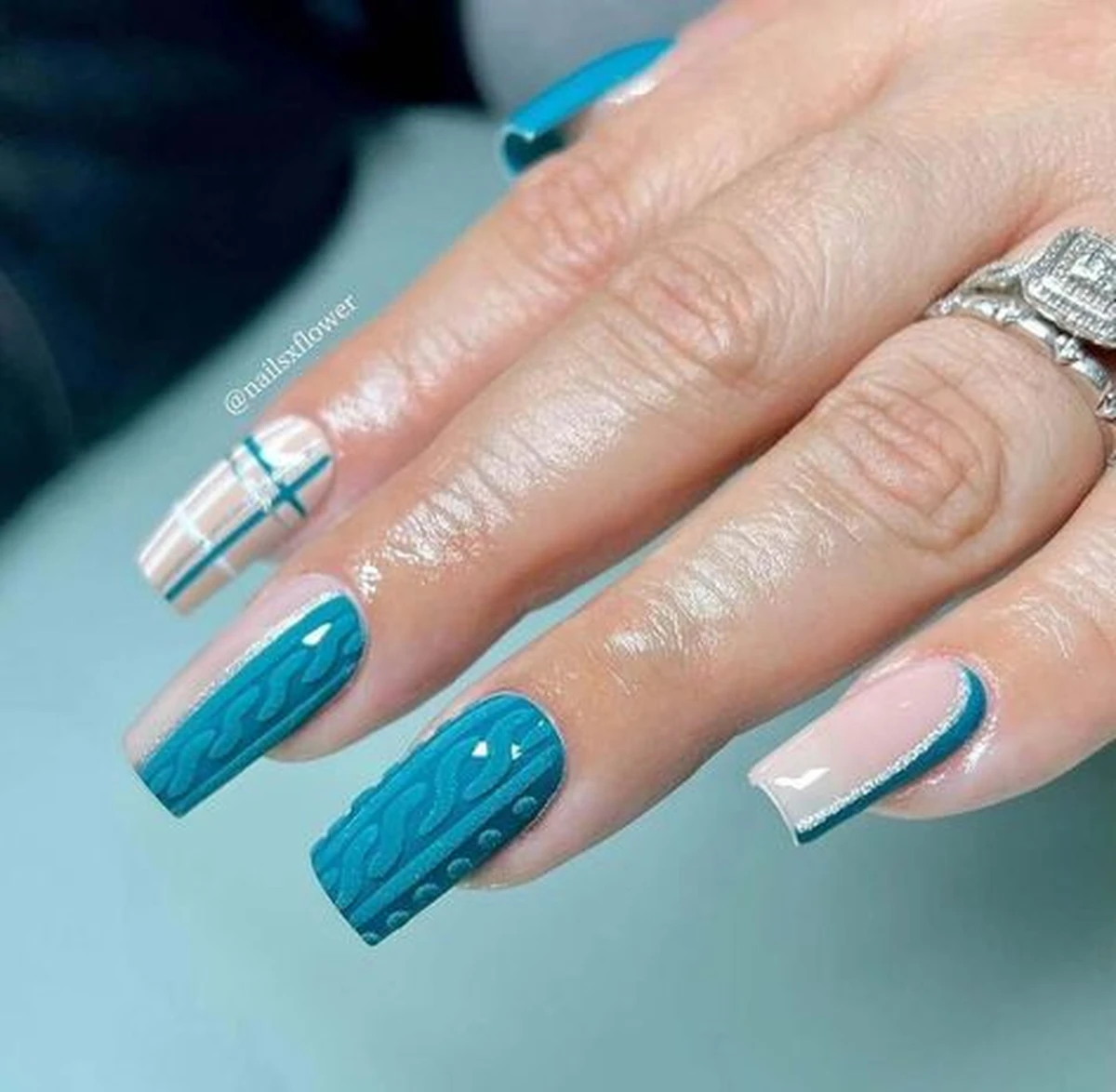 Teal knit sweater nails with cable pattern