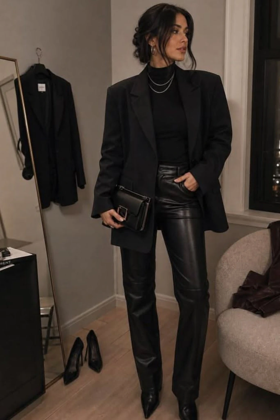 Woman in a longline blazer with leather pants