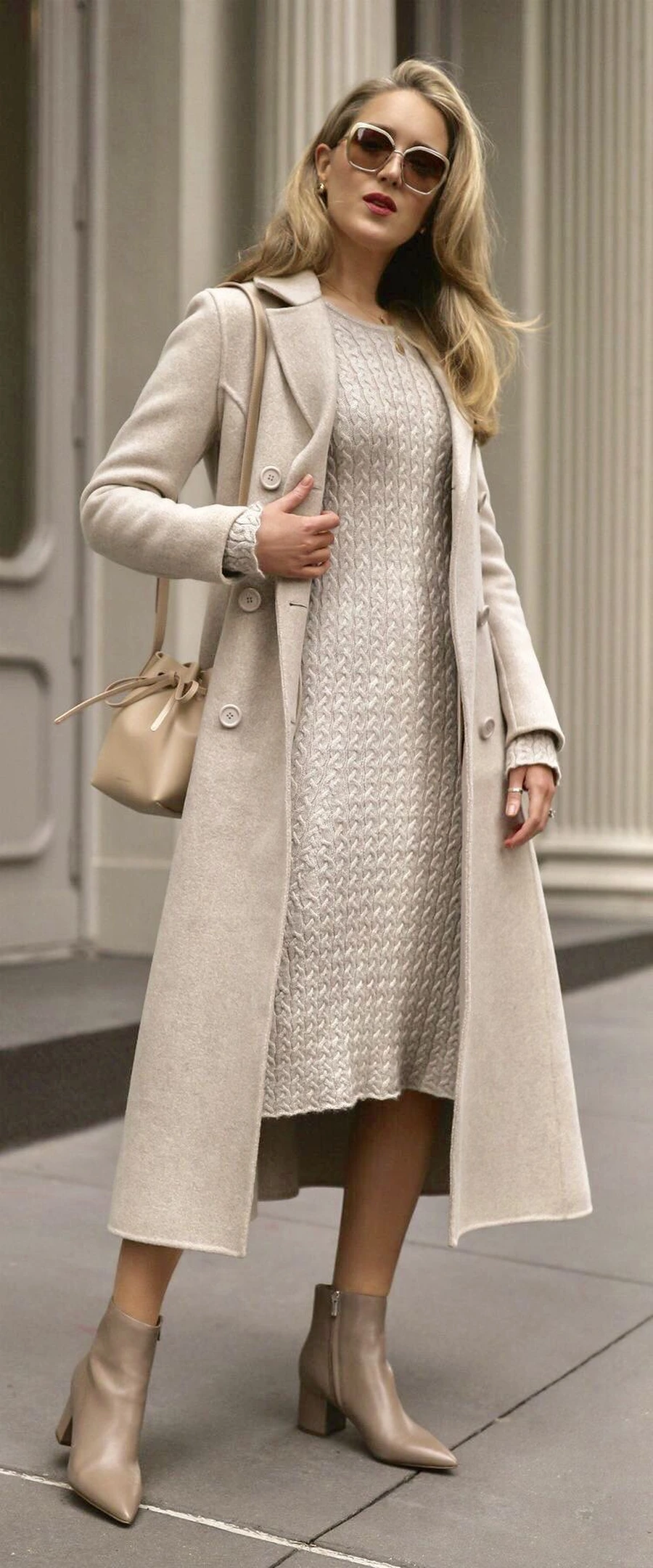 Woman in a wrap coat over a knit midi dress with block heels