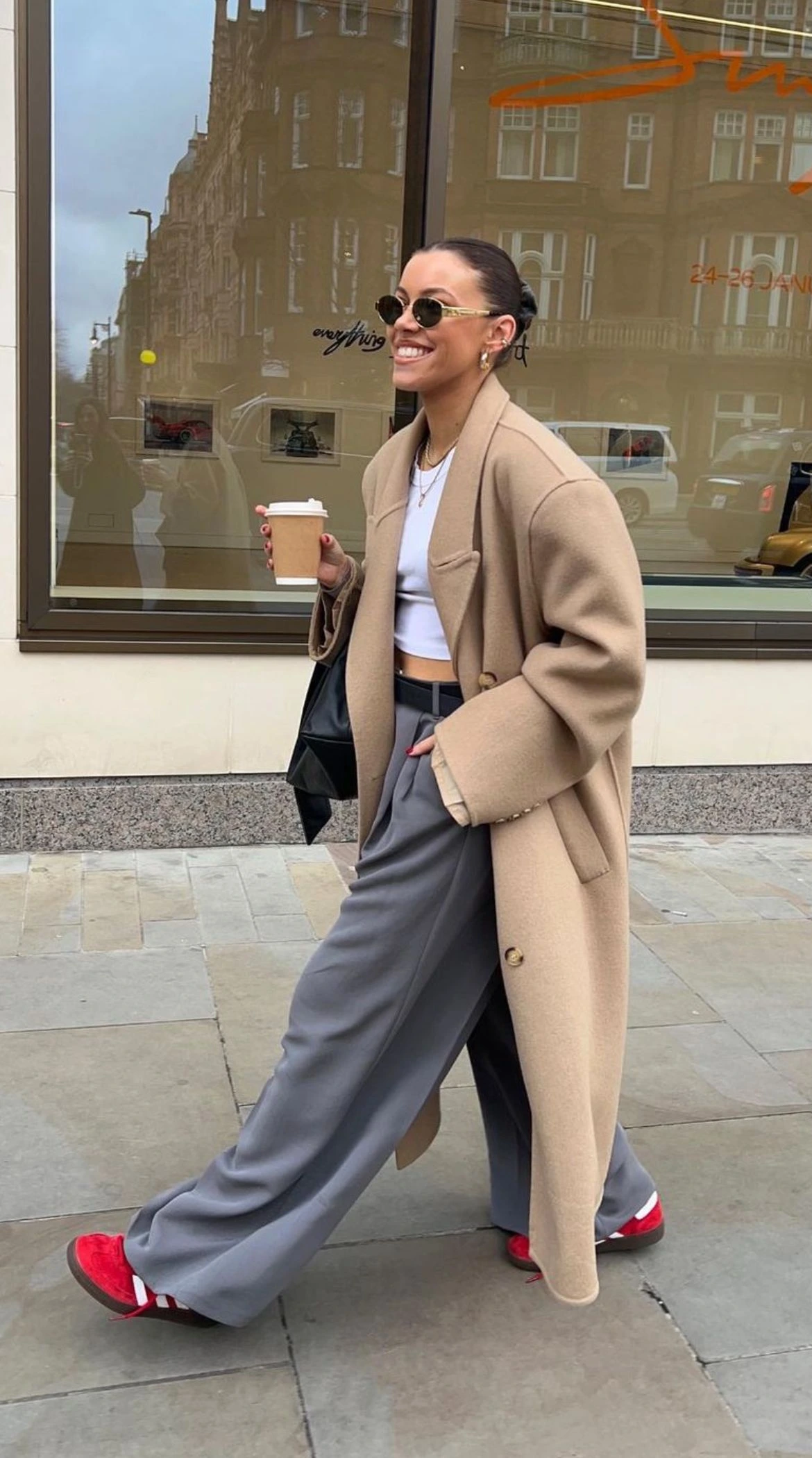 Woman wearing bold colour sneakers with a neutral fall outfit