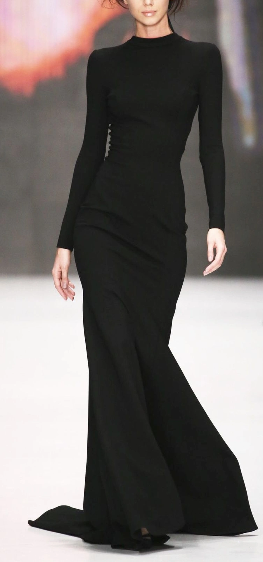 Tall woman in a single colour outfit with a long clean line