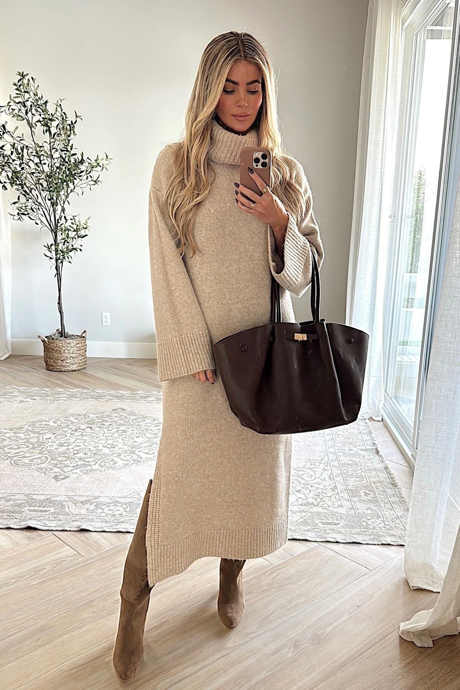 Tall woman wearing a sweater dress in winter