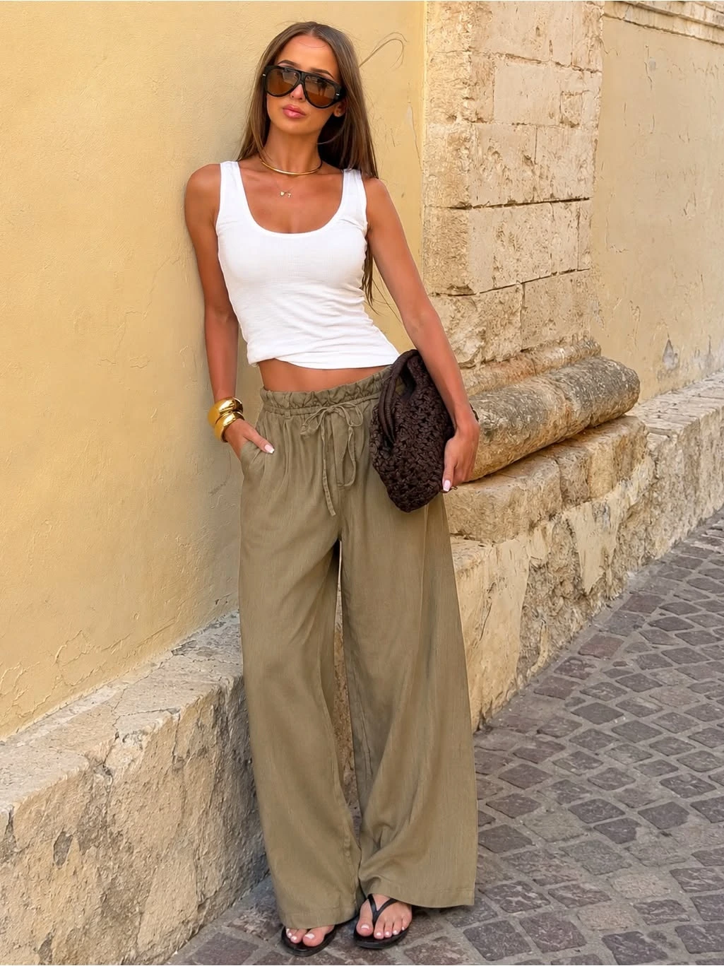 Olive Linen Pants With a White Tank and Sandals
