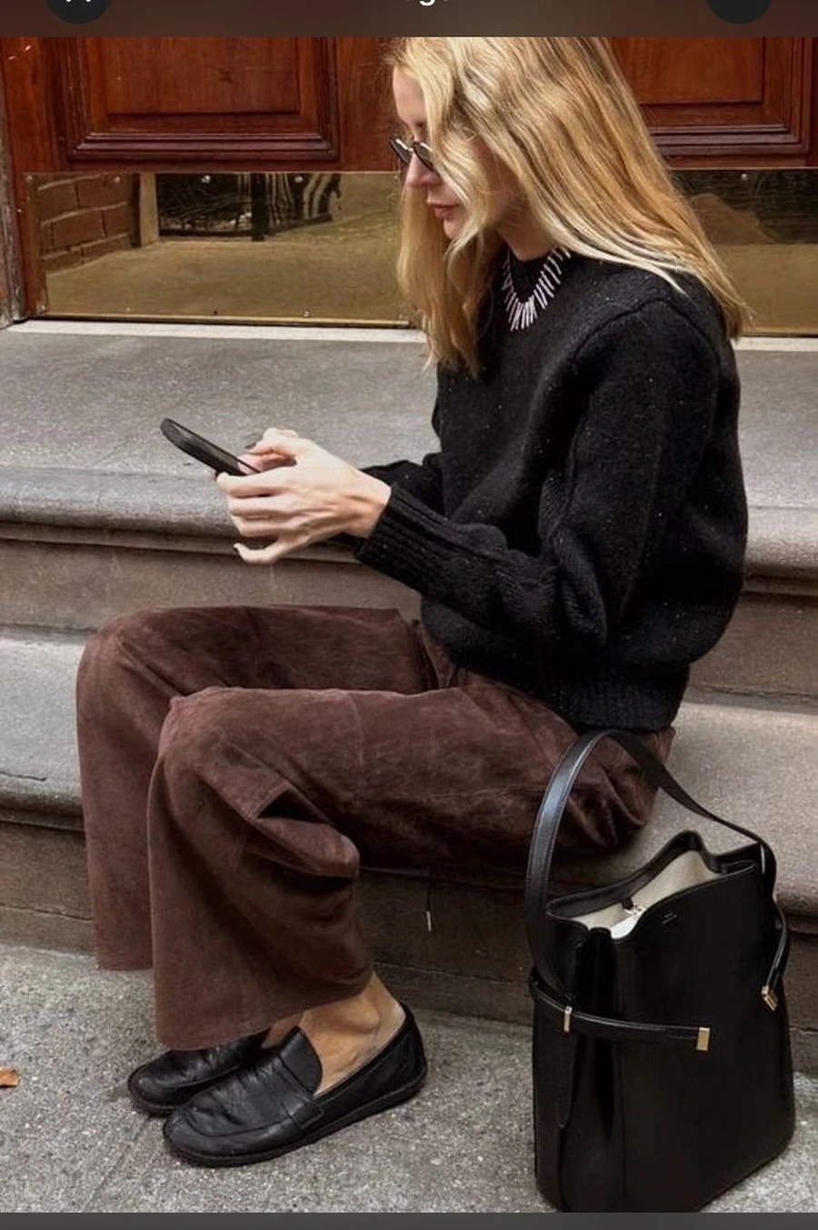 Brown Linen Pants With a Black Top and Loafers
