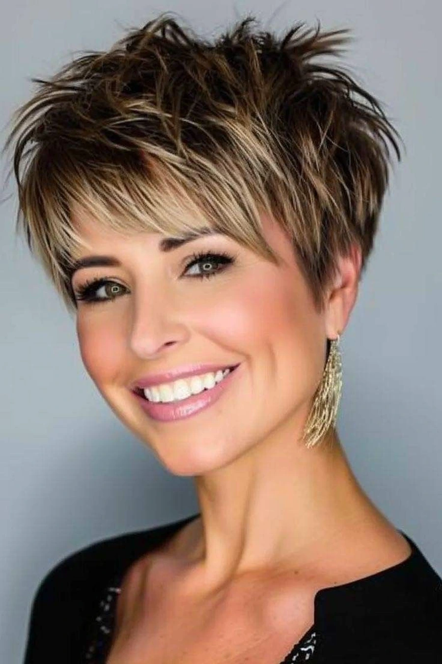 Woman with a textured spiky pixie and long fringe