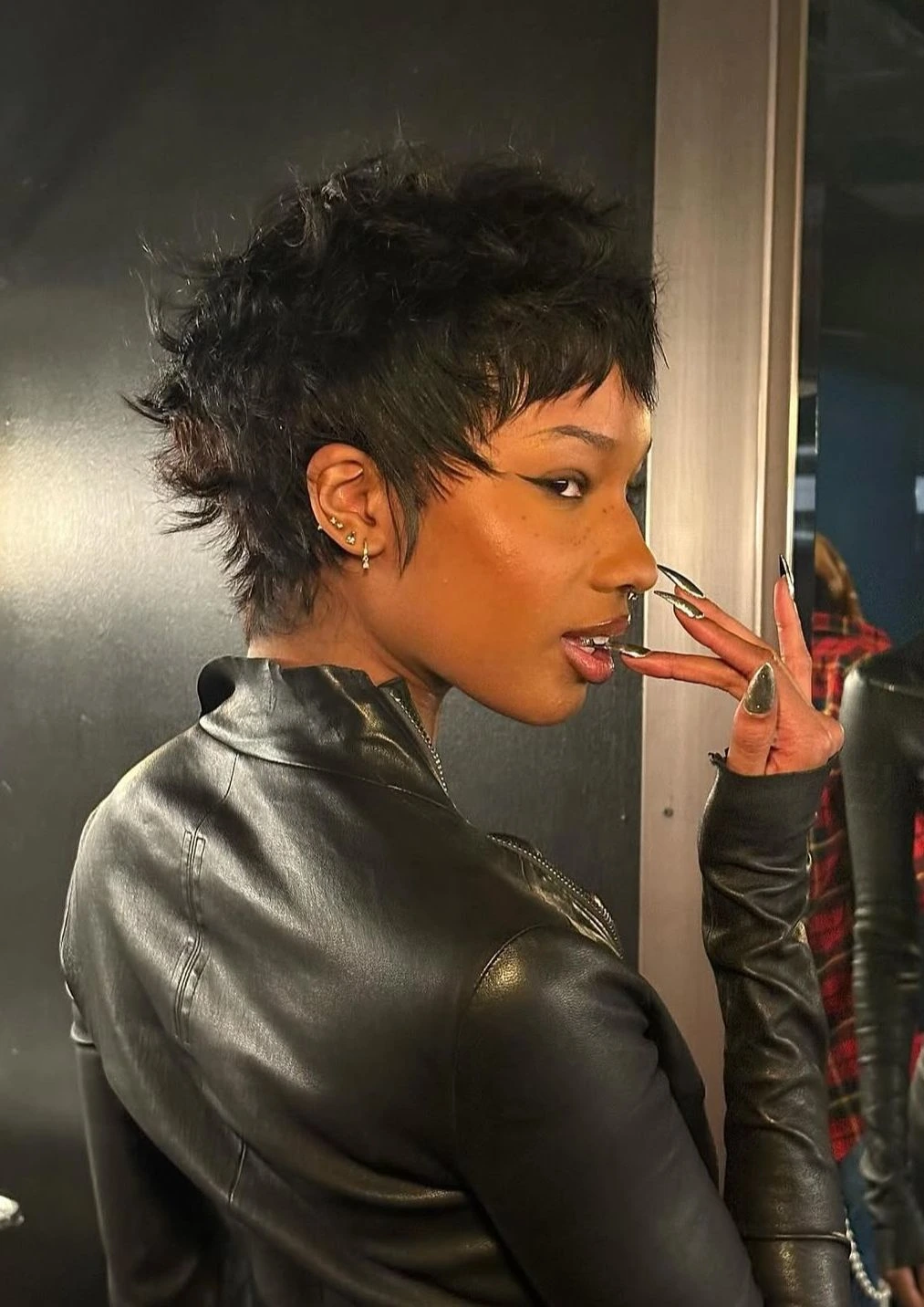 Woman with a spiky pixie and short micro fringe