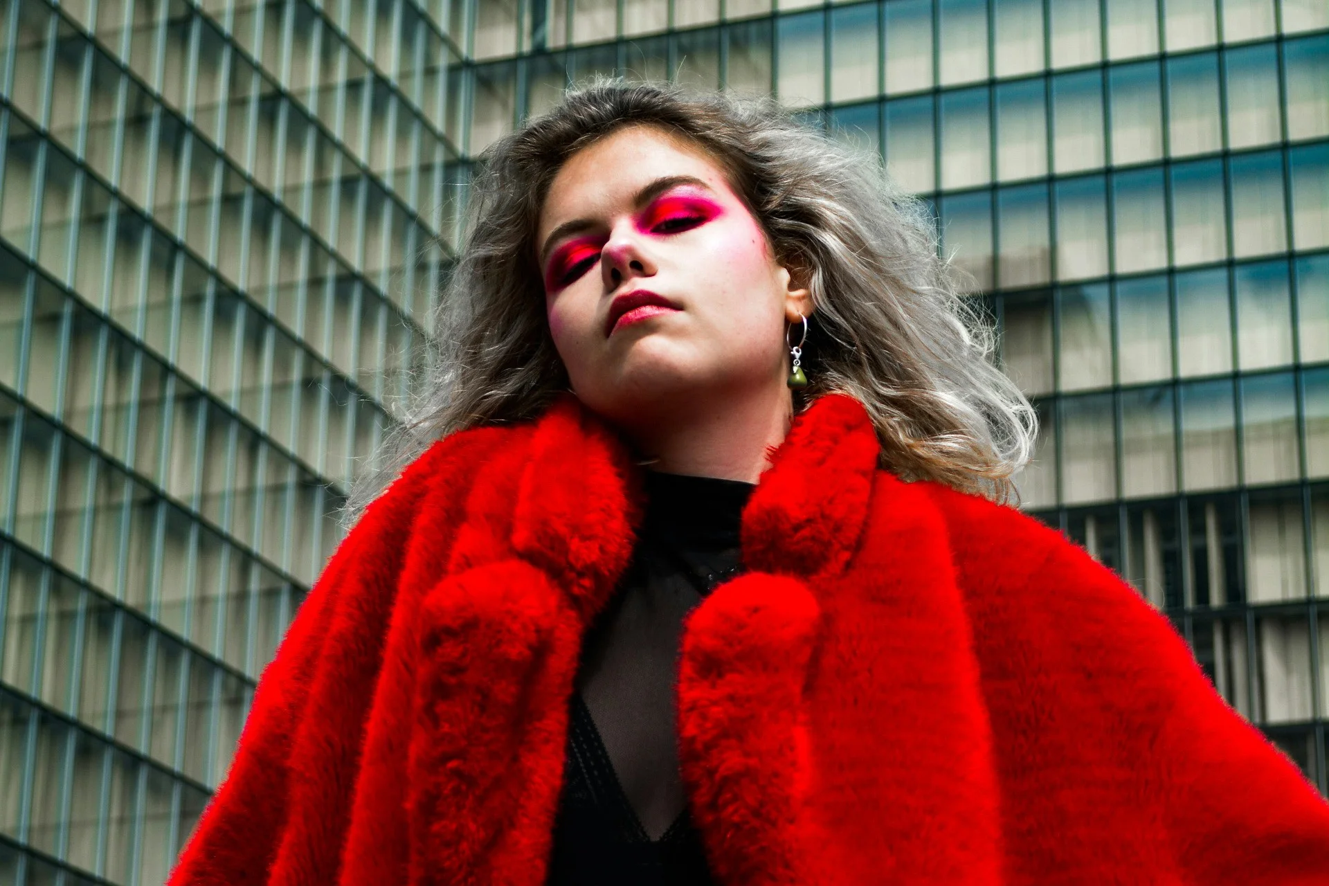 Red faux fur coat with sunglasses, mob wife outfit