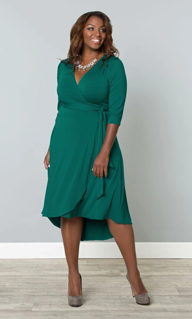 Teal wrap midi dress on a plus-size woman
