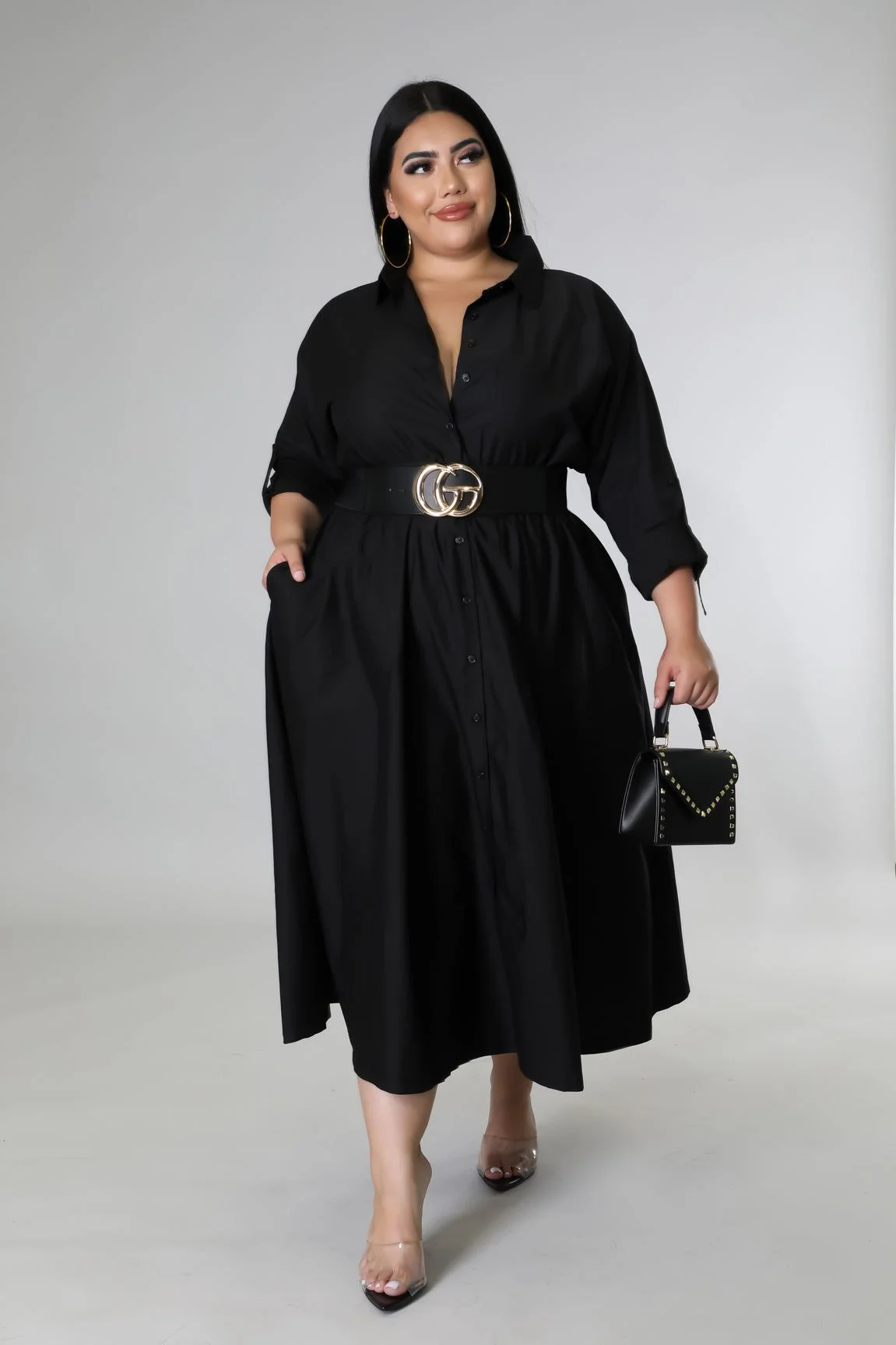 Black wrap maxi dress with belt on a plus-size woman